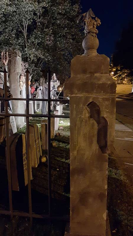 Night View of Front Gate Entrance to Halloween Graveyard Cemetery