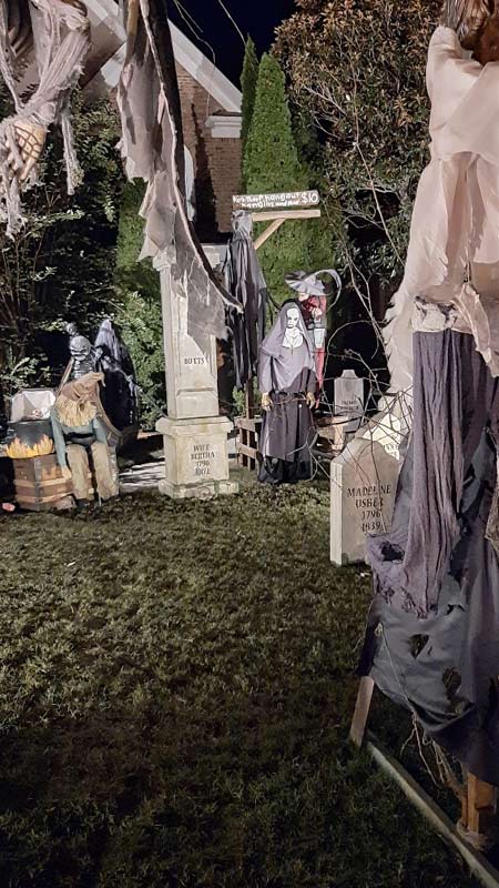 Night View of Front Gate Entrance to Halloween Graveyard Cemetery